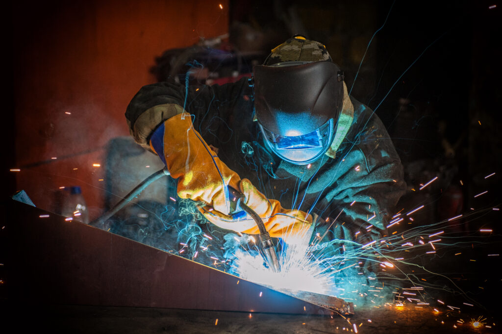 worker welding metal